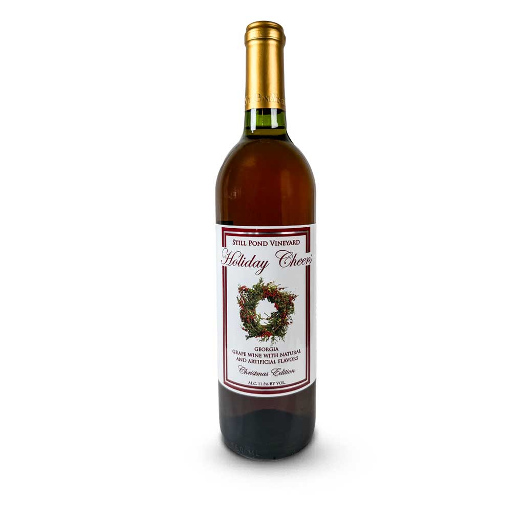  A bottle of Holiday Cheer wine with festive holiday decorations in the background.